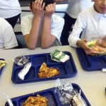 A Little Village Academy student cringes at an enchilada dish served at his school. Many students throw away their entrees uneaten and say they would rather bring food from home. The school, though, does not allow students to bring in their own lunches, unless they have a medical condition or a food allergy. (Monica Eng, Chicago Tribune / February 17, 2011)