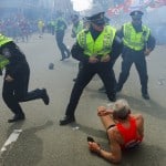 Boston police officers just after an explosion near the finish line of the Boston Marathon, Monday, April 15, 2013. (John Tlumacki/The Boston Globe)