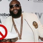 Rick Ross holding up the shoe he's no longer paid to endorse. Oh.